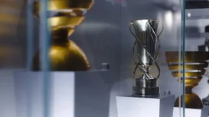 An elegant trophy displayed inside a glass case, showcasing achievement and excellence.